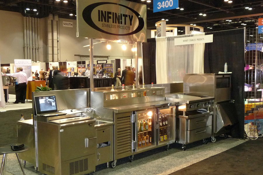image of various stainless steel backbar equipment at Nafem Trade Show Booth