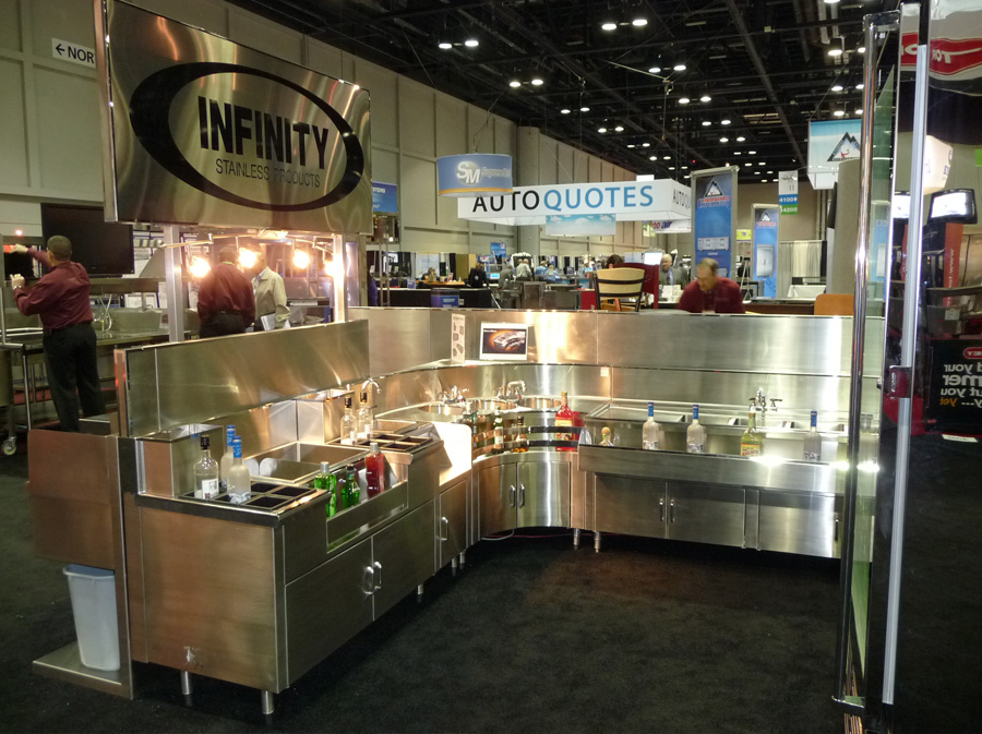 image of infinity stainless trade show booth at NAFEM showing various backbar equipment