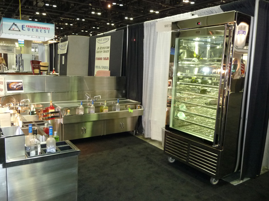 image of infinity stainless trade show booth at NAFEM showing various underbar equipment