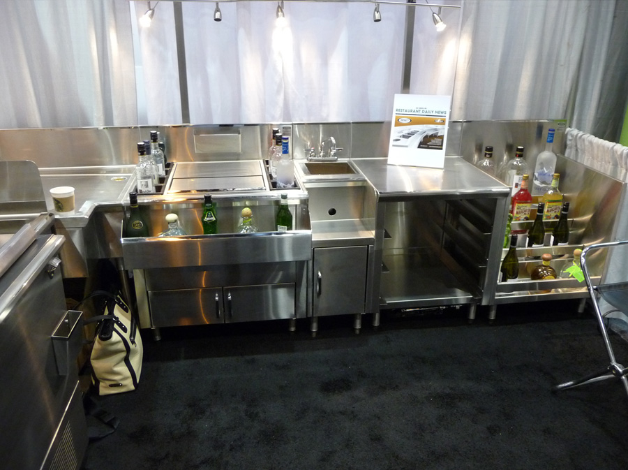 image of trade show booth with ice chest, hand sink, cabinet bass drainboard and liquor display cabinet