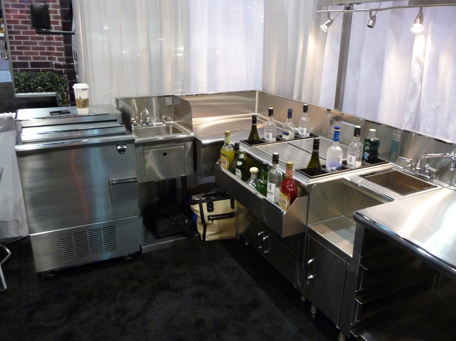 image of trade show booth with bottle cooler, hand sink and other backbar equipment