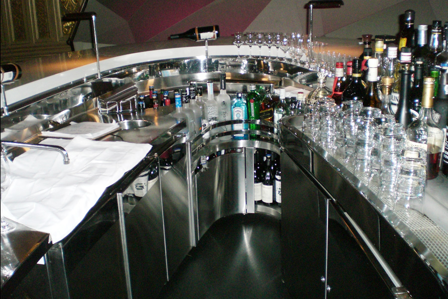 image of custom stainless steel architectural equipment in the shape of an oval with Mixology station, dump sink and and backbar refrigerators at New York Palace Hotel