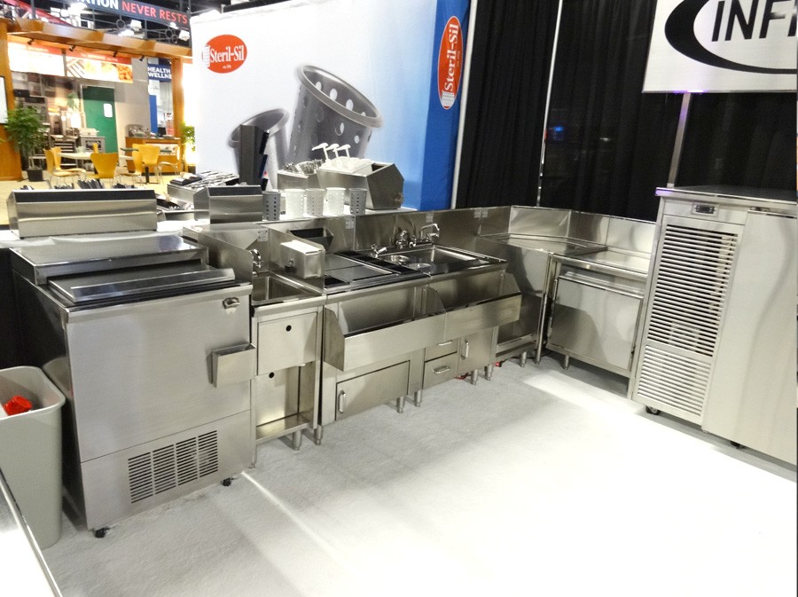 image of infinity trade show booth showing bottle cooler, one compartment sink, mixology station and backbar refrigerator with doors