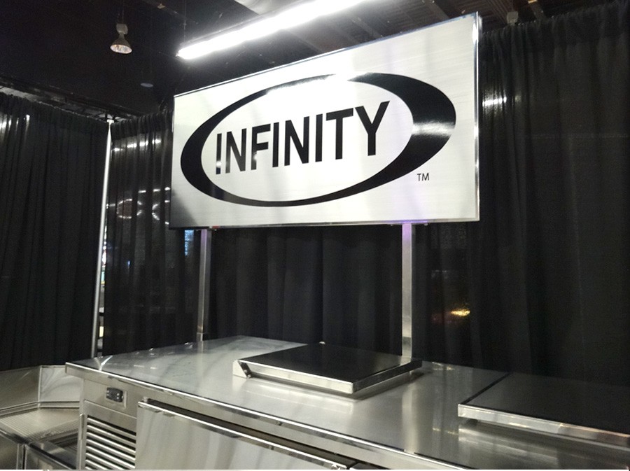 image showing backbar equipment with infinity stainless logo sign above